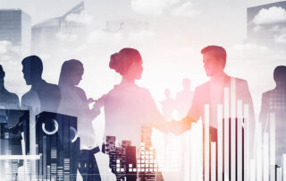 Silhouettes of business people shaking hands in front of a city, symbolizing Proposal Support for the Federal Government.