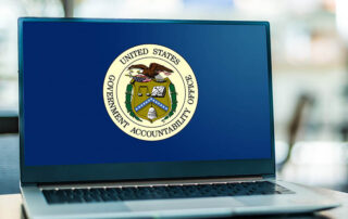 An image of a laptop that has Government Accountability Office on the screen.